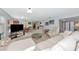 Large living area with cozy seating, providing comfortable flow to the dining space at 5417 Champagne # 63, Sarasota, FL 34235