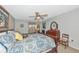Spacious main bedroom featuring neutral walls, a decorative ceiling fan, and a wooden dresser at 5417 Champagne # 63, Sarasota, FL 34235