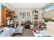 Cluttered home office space with a variety of decorations and office supplies at 5417 Champagne # 63, Sarasota, FL 34235