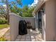 Private patio area with an outdoor grill, plants, and sliding glass door to the interior at 5417 Champagne # 63, Sarasota, FL 34235