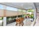 Bright sunroom featuring large windows with backyard views and comfortable seating at 5417 Champagne # 63, Sarasota, FL 34235