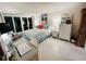 Well-appointed bedroom with a comfortable bed, ample lighting, and a view of the coastline at 555 The Esplanade N # 202, Venice, FL 34285