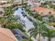 Wide aerial shot of a waterfront neighborhood featuring serene canals, lush landscaping and private boat docks at 584 Mast Dr, Bradenton, FL 34208