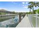 Deep water canal with dock in a beautiful backyard setting and lush landscaping at 584 Mast Dr, Bradenton, FL 34208