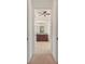 En-suite bathroom featuring double vanity with granite countertop and a ceiling fan at 584 Mast Dr, Bradenton, FL 34208