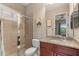 Bathroom features a glass-enclosed shower, granite countertop, and neutral tile at 584 Mast Dr, Bradenton, FL 34208