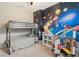 bedroom with bunk beds and a space themed wallpaper at 584 Mast Dr, Bradenton, FL 34208