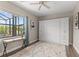 Bedroom with murphy bed and desk area, luxury vinyl flooring, and bright natural light at 584 Mast Dr, Bradenton, FL 34208