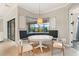 Cozy breakfast nook with bay windows and views of the screened-in pool at 584 Mast Dr, Bradenton, FL 34208
