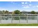 Backyard waterfront dock overlooking calm canal and neighboring houses at 584 Mast Dr, Bradenton, FL 34208