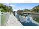Waterfront dock with lush landscaping at 584 Mast Dr, Bradenton, FL 34208