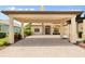 Home showcasing a grand porte-cochere and a beautifully brick-paved driveway at 584 Mast Dr, Bradenton, FL 34208