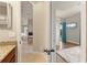 Hallway view showcases the light and airy feel, leading to a bedroom with a pool view at 584 Mast Dr, Bradenton, FL 34208
