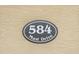 Close-up of a house number plaque reading '584 Mast Drive' at 584 Mast Dr, Bradenton, FL 34208