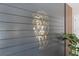 Close-up of a striking gold lion artwork on a dark wooden plank wall, enhanced by vertical wooden accents at 584 Mast Dr, Bradenton, FL 34208