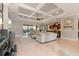 Spacious living room with coffered ceilings, open floor plan, and seamless indoor-outdoor flow at 584 Mast Dr, Bradenton, FL 34208