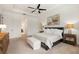 Relaxing main bedroom featuring plush bedding, decorative lighting, and a spacious layout at 584 Mast Dr, Bradenton, FL 34208