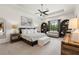 Serene main bedroom with tray ceilings, a cozy sitting area, and elegant decor at 584 Mast Dr, Bradenton, FL 34208