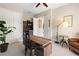 Cozy home office featuring a wooden desk, leather chair, ambient lighting, and inspirational wall art at 584 Mast Dr, Bradenton, FL 34208