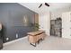 A sophisticated home office featuring a modern wooden desk, lion wall art, and built-in shelving with decor at 584 Mast Dr, Bradenton, FL 34208