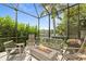 Cozy outdoor living space featuring comfortable seating around a stone fire pit at 584 Mast Dr, Bradenton, FL 34208