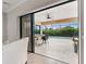 Covered patio with a bar, ceiling fan, and an outdoor seating area overlooks a swimming pool at 584 Mast Dr, Bradenton, FL 34208