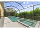 Screened-in pool area featuring a pool and a jacuzzi at 584 Mast Dr, Bradenton, FL 34208