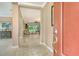 Bright foyer leads to an open living space with tiled floors and views of the outdoor area at 6214 45Th E Ln, Bradenton, FL 34203
