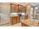 Kitchen boasts modern appliances, granite countertops, and dark wood cabinets providing ample storage space at 6214 45Th E Ln, Bradenton, FL 34203