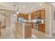 Well-lit kitchen with granite countertops, stainless steel appliances, and ample cabinet space at 6214 45Th E Ln, Bradenton, FL 34203
