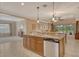Kitchen featuring a bar-height counter, granite counters, stainless steel appliances, and ample space at 6214 45Th E Ln, Bradenton, FL 34203