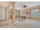Spacious and bright living room with carpet, ceiling fan and large windows offering plenty of natural light at 6214 45Th E Ln, Bradenton, FL 34203