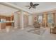Inviting living room featuring an open layout, neutral decor, and seamless flow to the kitchen at 6214 45Th E Ln, Bradenton, FL 34203