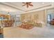 Bright and airy living room with a cozy sitting area that opens up to the kitchen at 6214 45Th E Ln, Bradenton, FL 34203