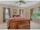 Serene main bedroom featuring a large bed, soft lighting, and cozy decor for a relaxing retreat at 6214 45Th E Ln, Bradenton, FL 34203