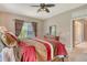 Comfortable main bedroom with a large window offering lots of natural light and warm, inviting colors at 6214 45Th E Ln, Bradenton, FL 34203