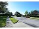 Street view showcasing the well-maintained landscaping and quiet atmosphere of this residential neighborhood at 6214 45Th E Ln, Bradenton, FL 34203