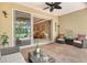 View from the covered patio into the living room showing an open floor plan at 6214 45Th E Ln, Bradenton, FL 34203