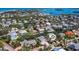 Stunning aerial view of a residential neighborhood with waterfront properties and lush landscaping at 663 Penfield St, Longboat Key, FL 34228