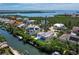 Beautiful aerial view showcasing waterfront homes, lush greenery, and direct access to open water at 663 Penfield St, Longboat Key, FL 34228
