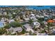 Stunning aerial view of a residential neighborhood with waterfront properties and lush landscaping at 663 Penfield St, Longboat Key, FL 34228