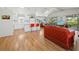 Open-concept living space with a modern kitchen, skylights, hardwood floors and seamless indoor-outdoor flow at 663 Penfield St, Longboat Key, FL 34228