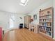 Light-filled office space with a skylight, desk, bookcase, and wood floors at 663 Penfield St, Longboat Key, FL 34228
