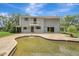 View of the back of the house with a pool and a large yard at 6633 Old Ranch Rd, Sarasota, FL 34241