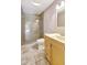 Bathroom showcasing a walk-in shower with glass door and light wood vanity at 6633 Old Ranch Rd, Sarasota, FL 34241