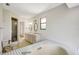 Bathroom with double sinks and a tiled tub at 6633 Old Ranch Rd, Sarasota, FL 34241