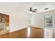 Light-filled bedroom with hardwood floors and an outdoor balcony view at 6633 Old Ranch Rd, Sarasota, FL 34241