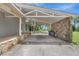 Covered carport with stone accents, providing ample space and protection for vehicles at 6633 Old Ranch Rd, Sarasota, FL 34241