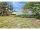 Spacious lot featuring a metal outbuilding in a partially cleared yard with mature palm trees at 6633 Old Ranch Rd, Sarasota, FL 34241