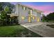 Two story home with a balcony, spacious yard, and pool at dusk at 6633 Old Ranch Rd, Sarasota, FL 34241